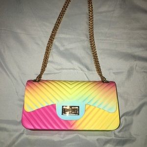 Multicolored chain purse with spacious inside.